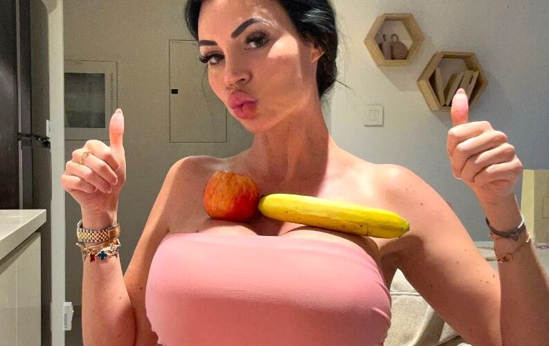 Model Yvonne Bar earns £1 million a year after spending £50000 on H cup breast surgeries as fans pay her to balance items on them turning her curves into a global brand.