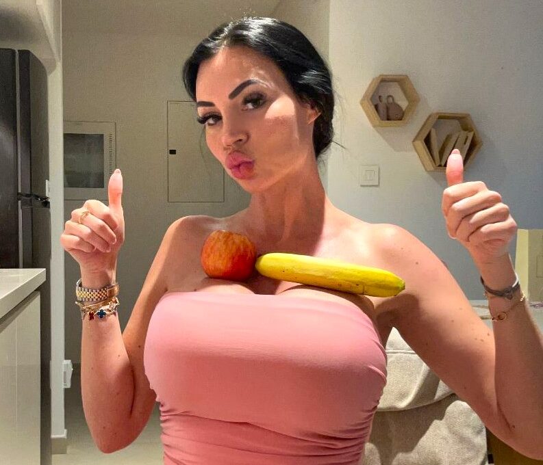 Model Yvonne Bar earns £1 million a year after spending £50000 on H cup breast surgeries as fans pay her to balance items on them turning her curves into a global brand.
