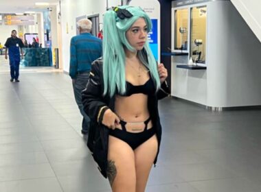 A model says she was banned from boarding her flight for wearing a revealing cosplay outfit sparking debate as fans defend her and others say airport staff were right to enforce rules.