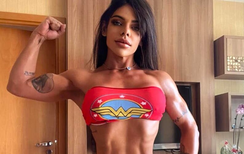 Suzy Cortez shows off extreme strength by pulling a two-tonne truck with her bare hands as part of her intense military-style fitness routine.