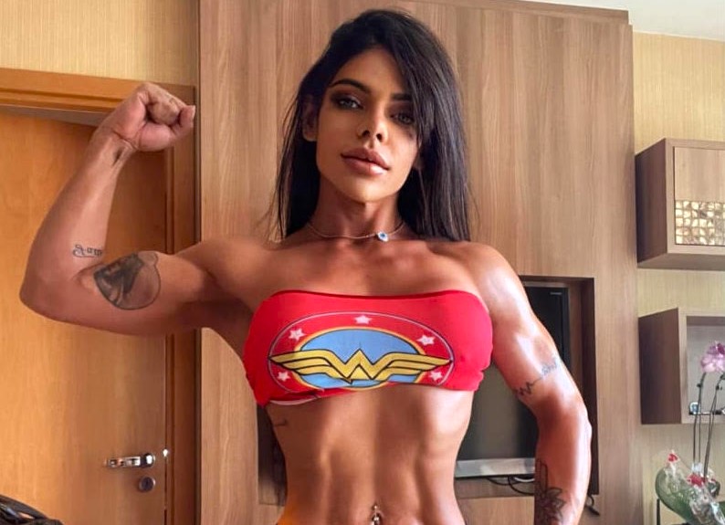 Suzy Cortez shows off extreme strength by pulling a two-tonne truck with her bare hands as part of her intense military-style fitness routine.