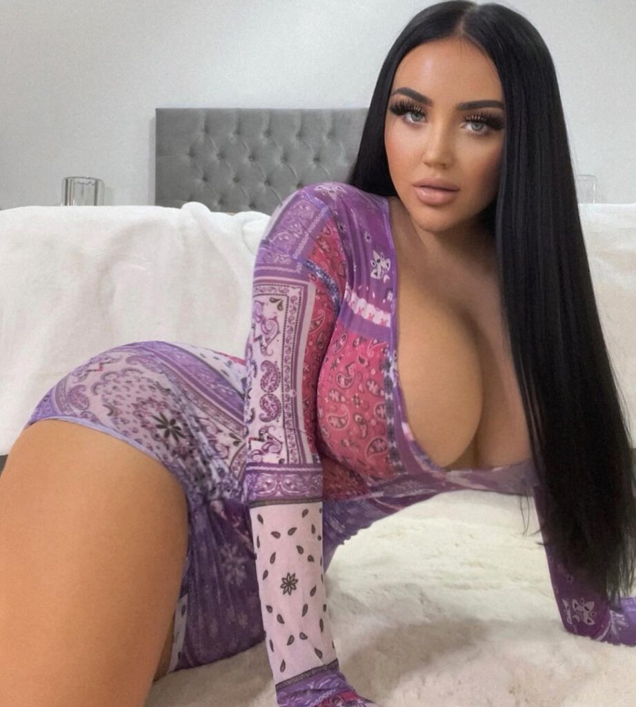 OnlyFans model Amy Sophia posing for a photo - NudeNewz