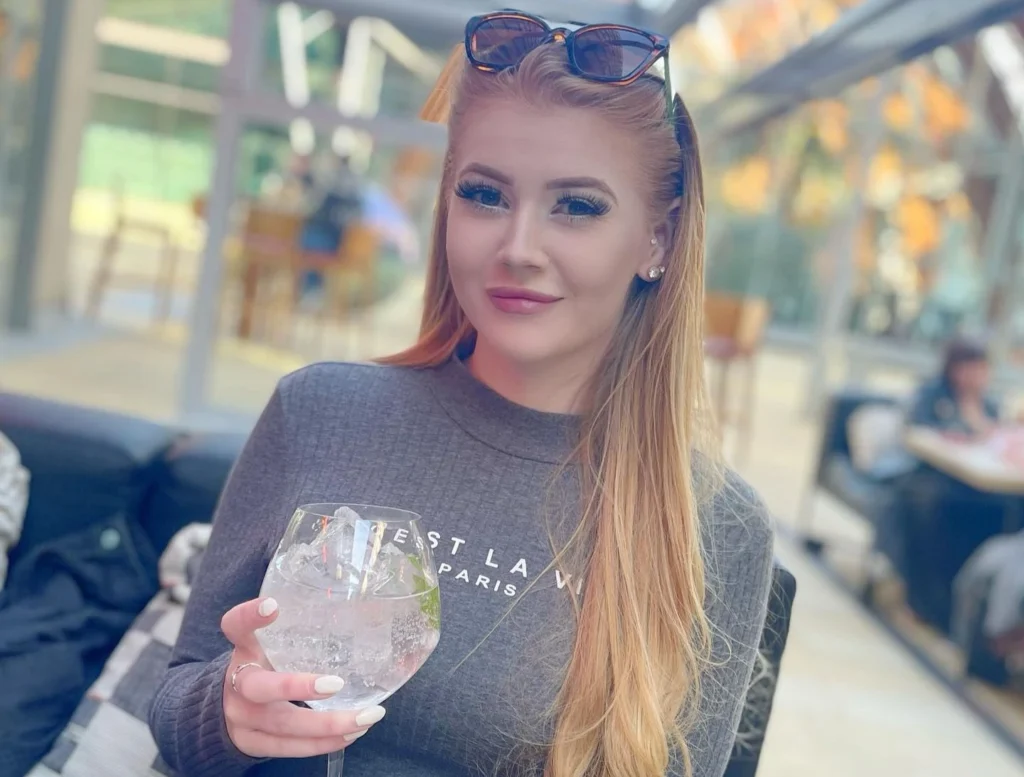 OnlyFans model Belle Grace posing for a photo - NudeNewz