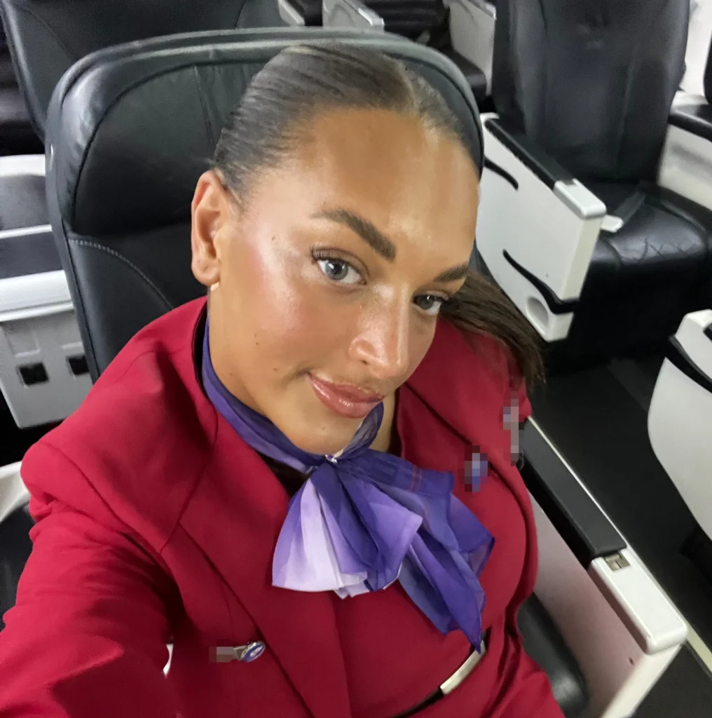 Alanna Pow in her flight attendant uniform - NudeNewz