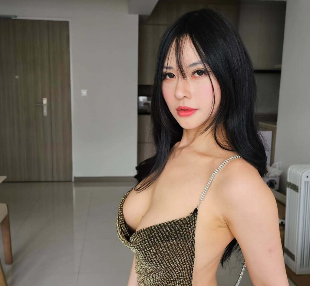 OnlyFans model Krystal Wang posing for a photo - NudeNewz