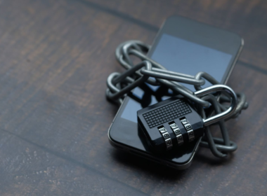 Smartphone secured with a padlock and chain, representing digital privacy and protection from deepfakes