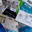Stack of credit cards fanned out, representing Mastercard's 2026 adult-content processing fee changes