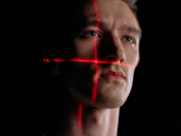 Facial-scan grid overlay on a portrait, representing AI and deepfake content detection policy