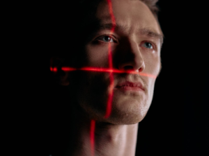 Facial-scan grid overlay on a portrait, representing AI and deepfake content detection policy