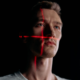 Facial-scan grid overlay on a portrait, representing AI and deepfake content detection policy