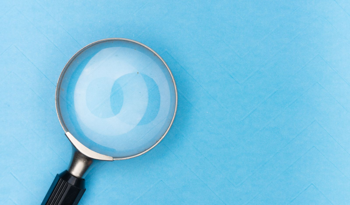 Magnifying glass on a plain background, representing the search for discoverability on creator platforms