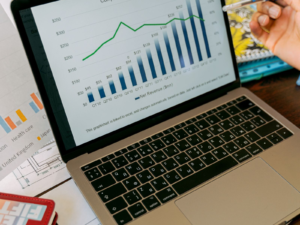 Financial charts and statistics displayed on a laptop screen, representing OnlyFans creator earnings data