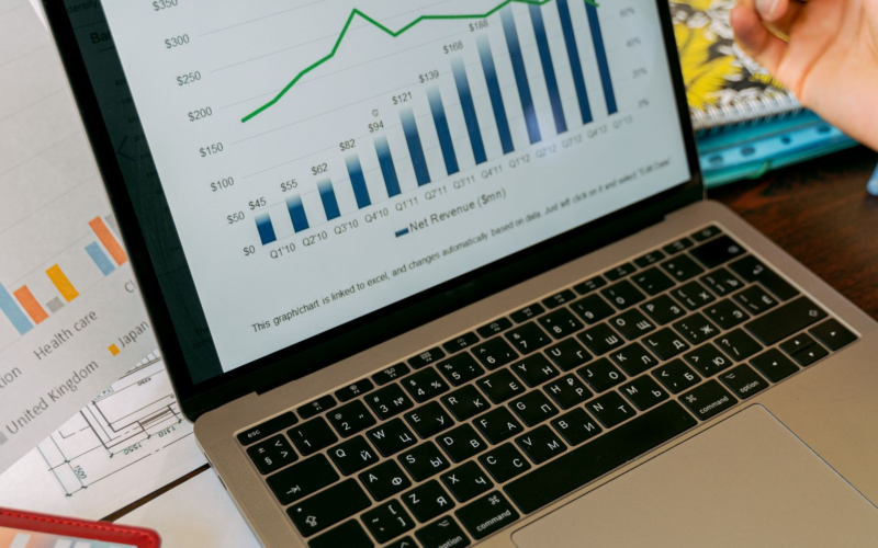 Financial charts and statistics displayed on a laptop screen, representing OnlyFans creator earnings data