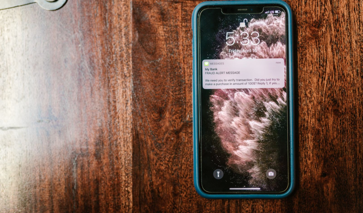Smartphone on a wooden surface showing a message notification, representing fan engagement and retention for creators