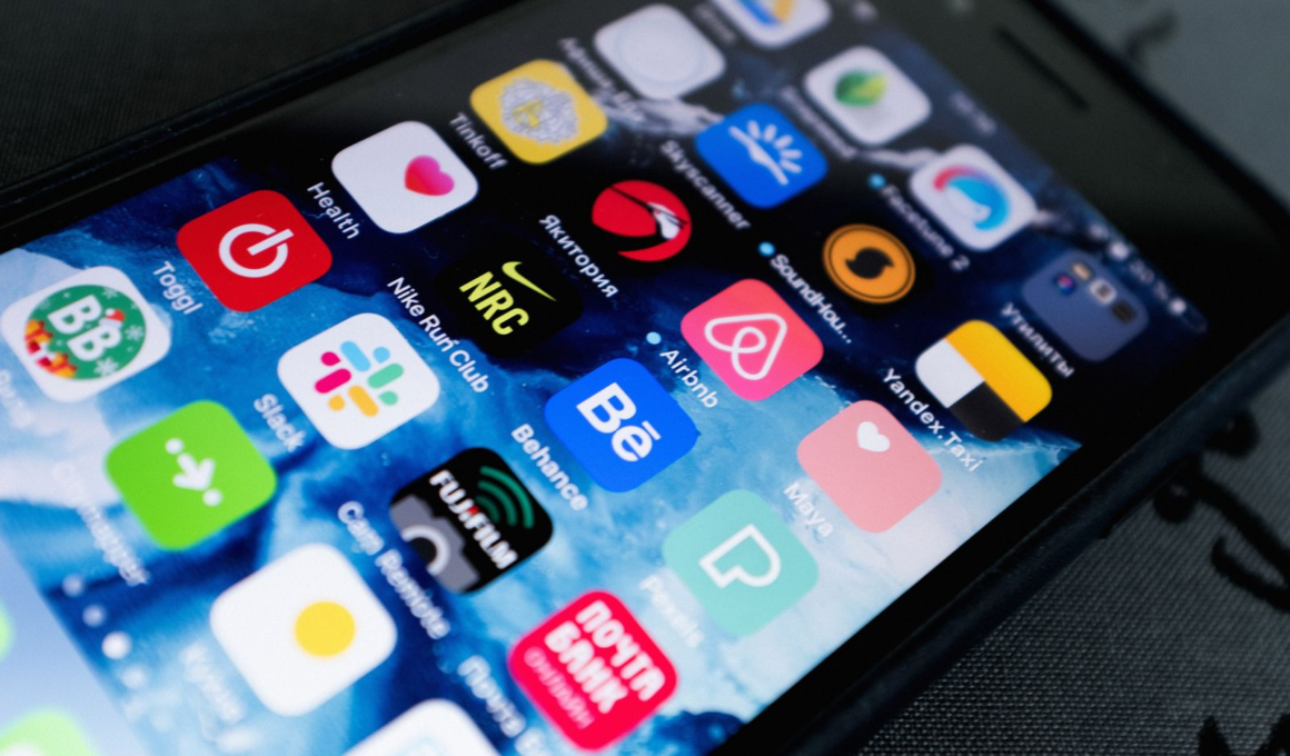 Smartphone screen full of app icons, representing a comparison between creator subscription platforms
